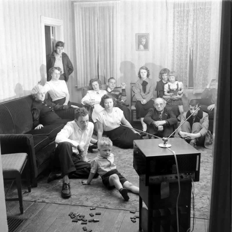 Truck driver Robert Nuher and his family gathered around the television in 1949, at a time when screens first invaded the American living room. (Pennsylvania, Photo by Ralph Morse) - History Forgotten Moments Unseen Photos