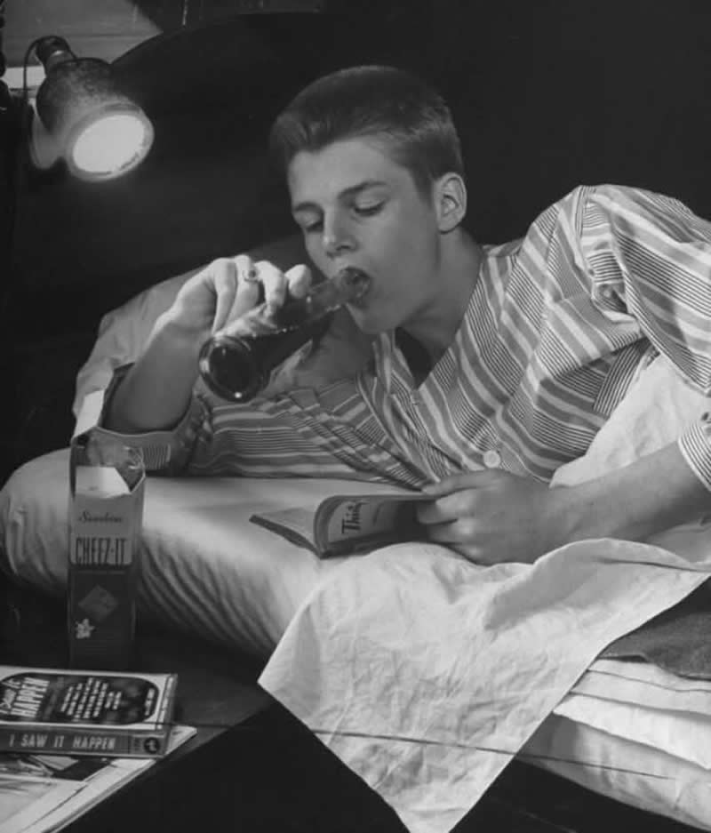 A teenager having a cola and a box of Cheez-It before going to bed in Des Moines, Iowa, 1945. - Old Photos That Capture Rare and Forgotten Moments in History