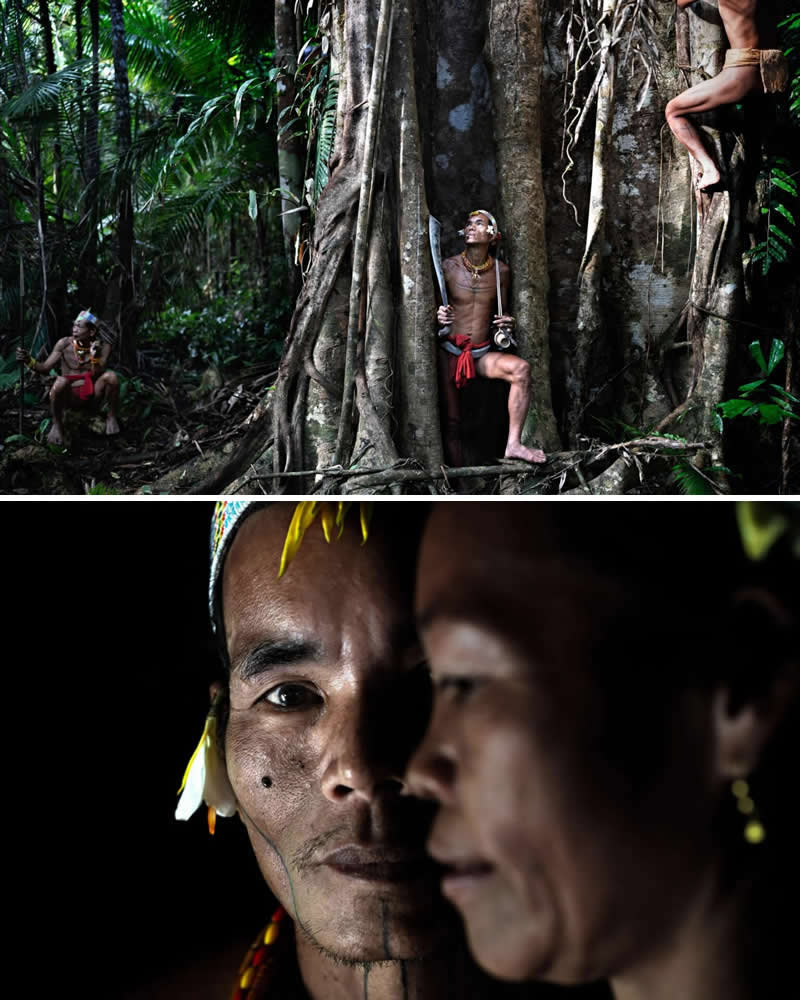 Alessandro Bergamini’s Portraits That Connect People to Their Landscapes 28 A Mentawai Sikerei shaman stands with fellow villagers in Indonesia’s lush rainforest, surrounded by towering jungle trees. The image captures the close spiritual and cultural bond the Mentawai people share with their forest, reflecting their deep connection to the land and its traditions.