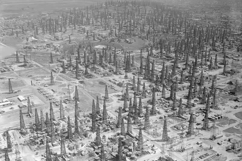 33 Unseen Photographs That Reframe American History 51 Oil derricks on a hillside in Pennsylvania 1895