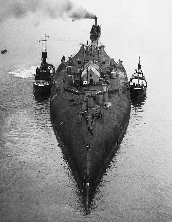 The German battlecruiser Prinz Regent Luitpold being towed back to Rosyth, flipped keel-up