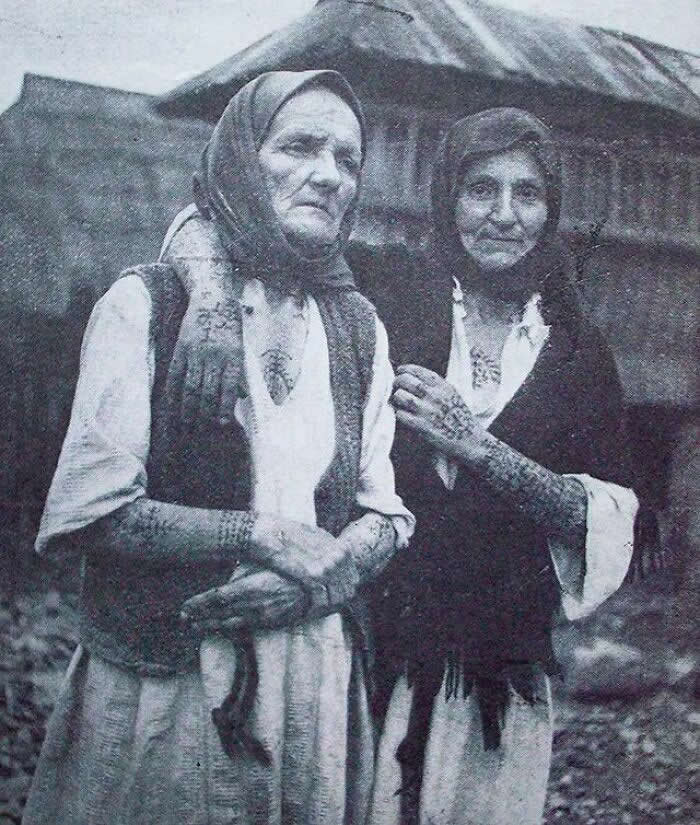 Elderly women with tattoos characteristic of Croatian Catholics in Bosnia. Central Bosnia, late 1930s