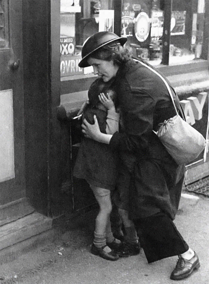 A mother comforting her child during the Blitz 1940s