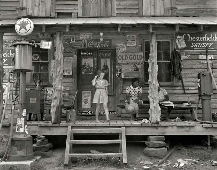 Daughter of white tobacco sharecropper at country store. Person County, North Carolina By Dorothea Lange - July, 1939.