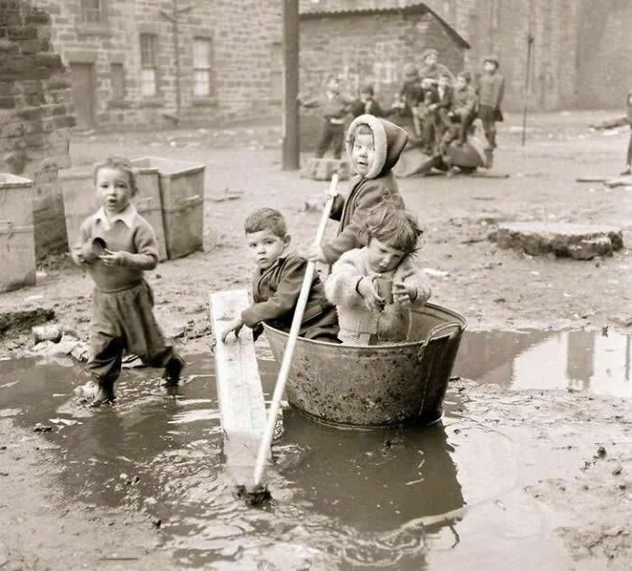 Kids playing in the mud, 1960s Glasgow