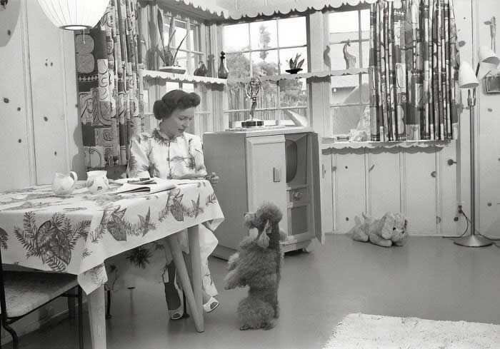 Betty White in her Los Angeles home with her dog, 1952