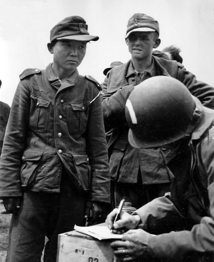From Korea to Normandy: The Soldier Who Wore Three Uniforms. On June 7, 1944&mdash;just one day after D-Day&mdash;a soldier from the U.S. 5th Engineer Special Brigade, identifiable by the white bow on his helmet, was registering newly captured Wehrmacht prisoners on Utah Beach, Normandy.