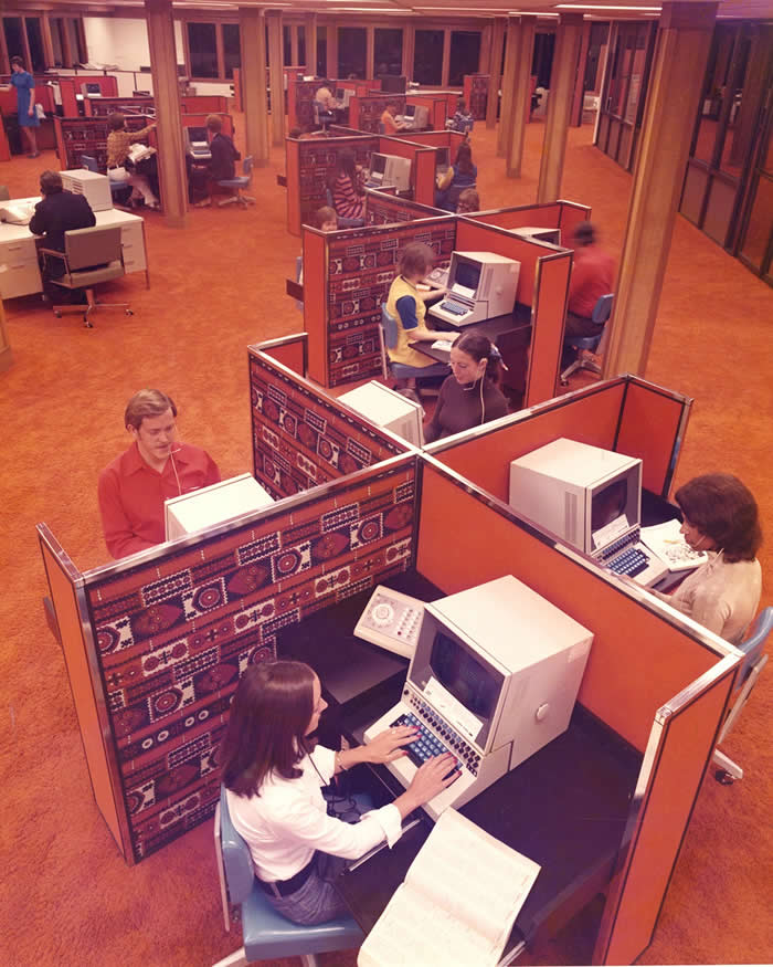 Hughes Airwest employees working at mainframe terminals, circa 1971-1978.