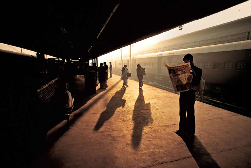 Train Station Platform, Old Delhi, India by Steve McCurry - Iconic Color Photos by Legendary Photographers