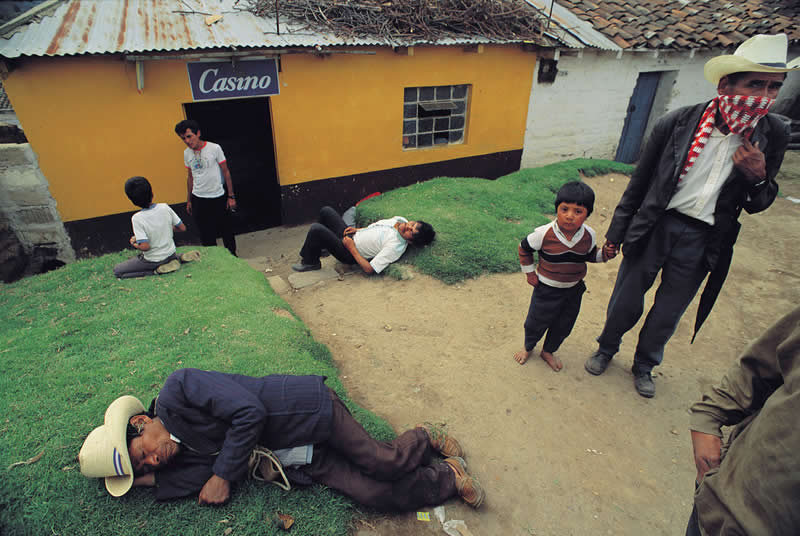 Market day, drunken men in front of a bodega, San Francisco El Alto, Guatemata by Thomas Hoepker - Iconic Color Photos by Legendary Photographers