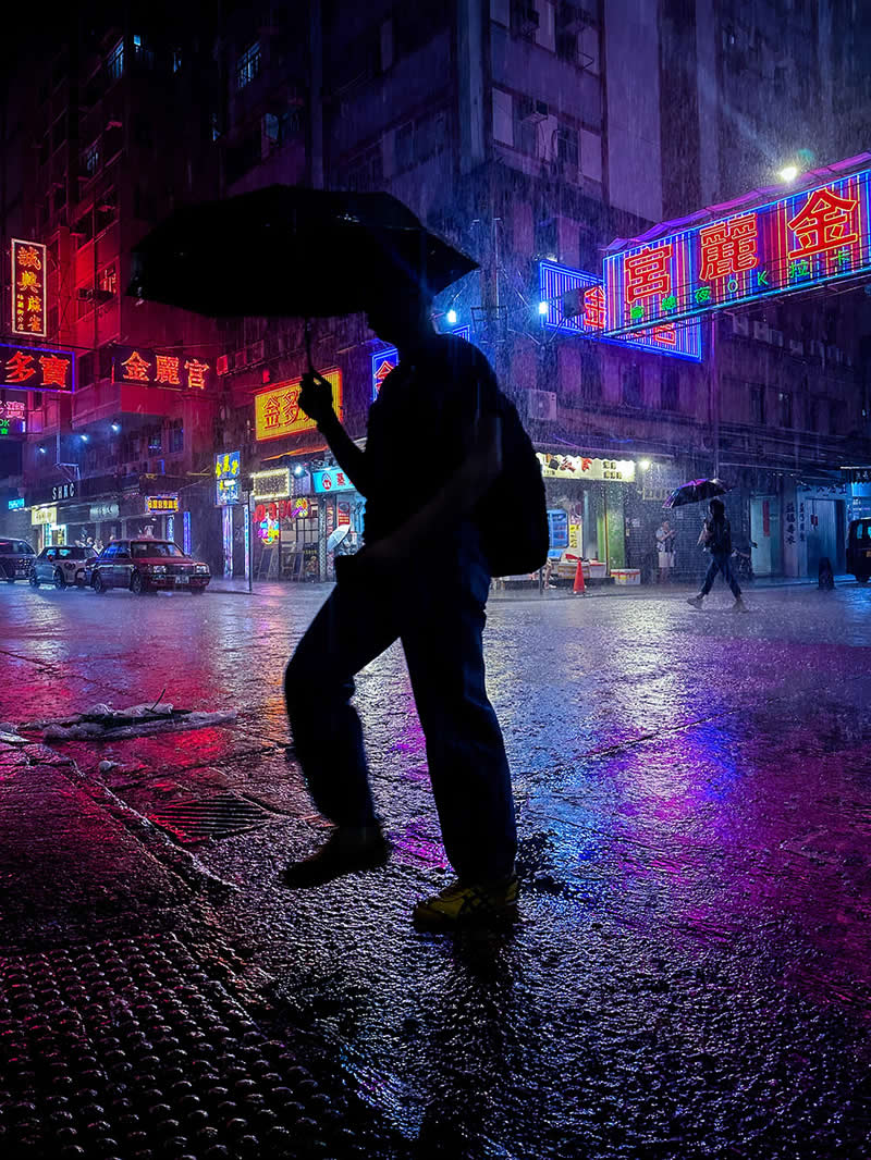 Shot on Phones: 33 Amazing Silhouette Photos That Redefine Mobile Photography 68 Walker on Neon Lava by Yuepeng Bao - Mobile Photography Awards Silhouettes Winners