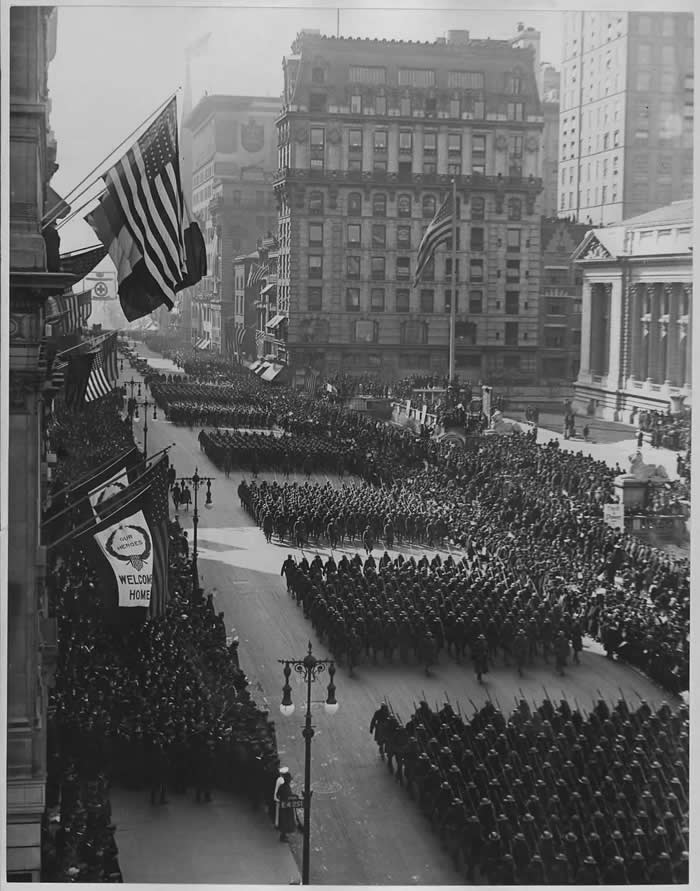 Parade in honor of returned fighters from World War I passing the Public Library, New York City. ca. 1919.
