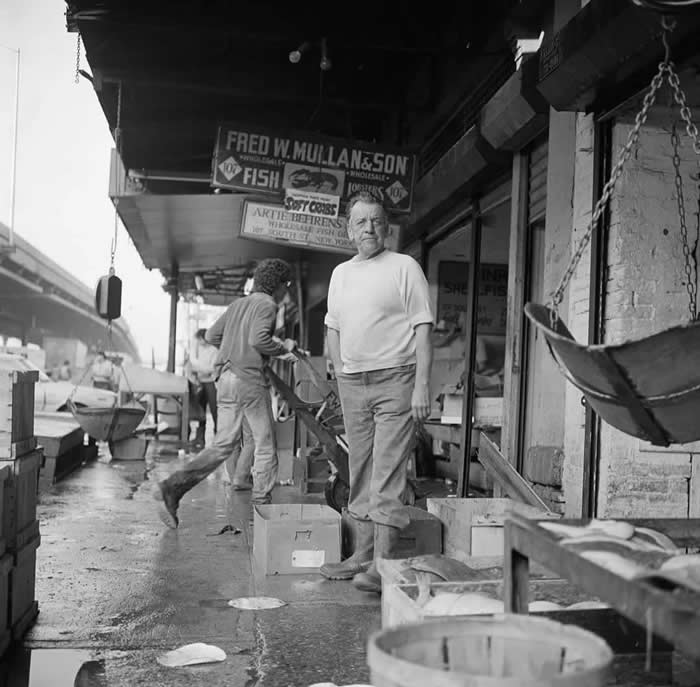 A business owner at the Fulton Fish Market, New York, 1982.