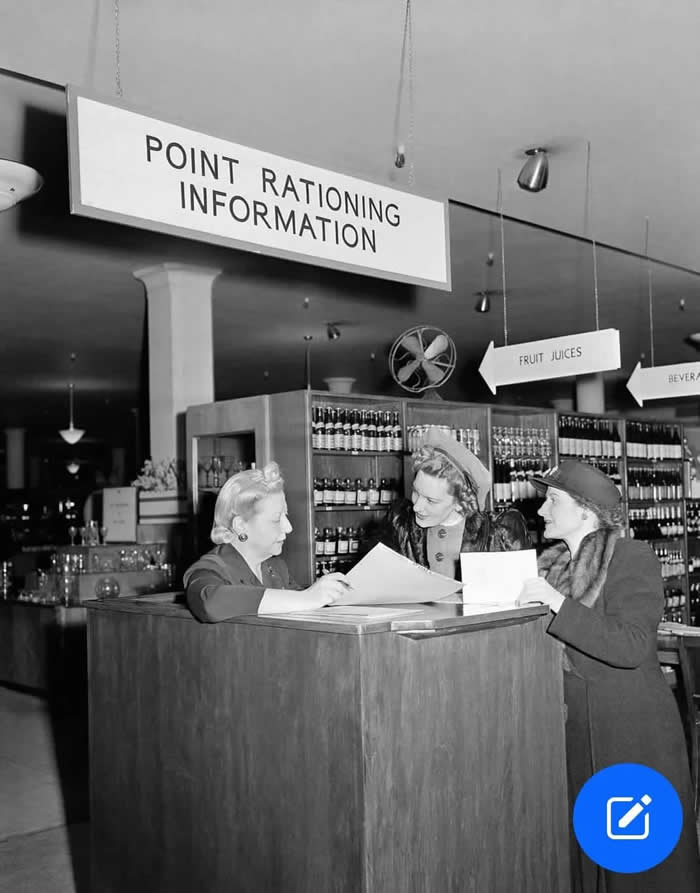 Shopping with a point rationing coupon on the first of rationing, at Macy's department store in New York, 1943.