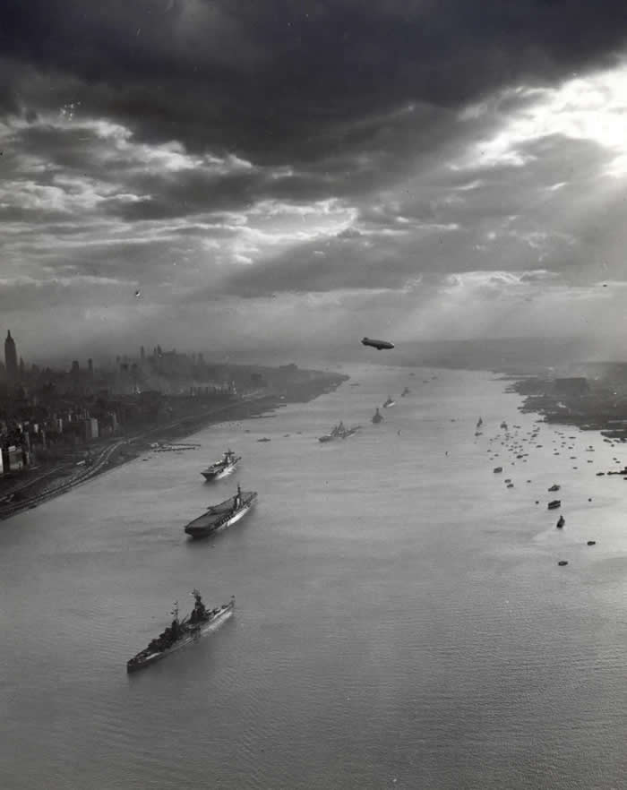 U.S. Navy warships pictured in the Hudson River with the New York City skyline in the background for the Navy Day celebrations on 27 October 1945.