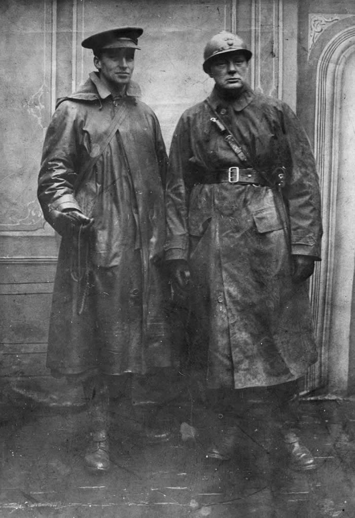 Winston Churchill (1874 - 1965, on the right) as 1st Colonel, commanding the Royal Scots Fusiliers wearing a trench coat, standing with Sinclair at Armentieres, February 1916.