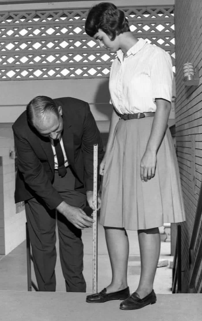 Rickards High School principal checking skirt length in Tallahassee, USA. 1965
