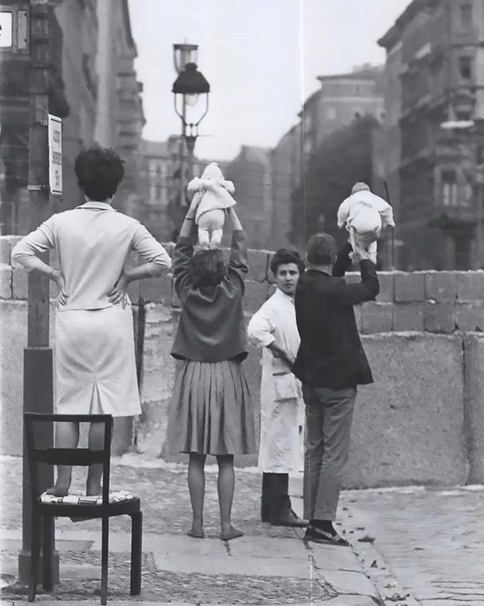 Residents of West Berlin show their children to their grandparents living in East Berlin, 1961