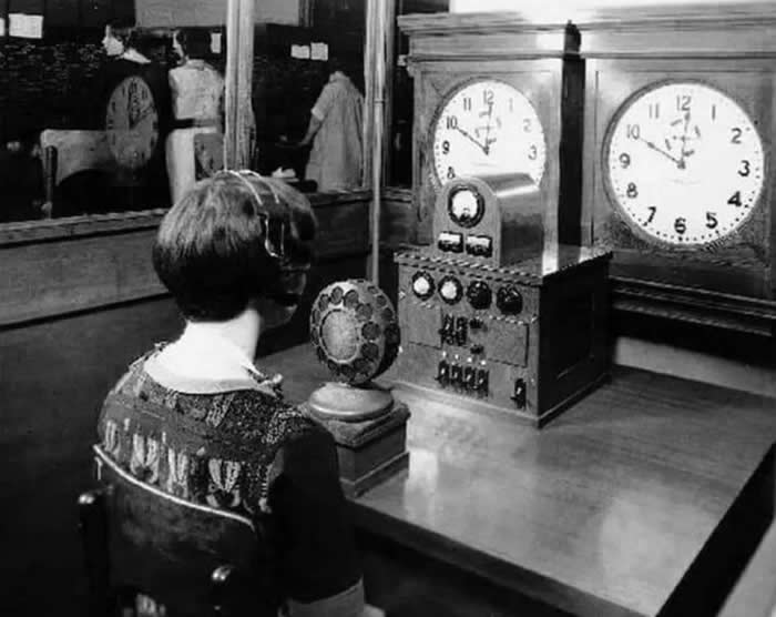 The "Time Lady" or the "Speaking Clock" this lady is in Chicago 1930. The lady would give the time 'live' every 15 seconds before the automated system arrived in 1937.