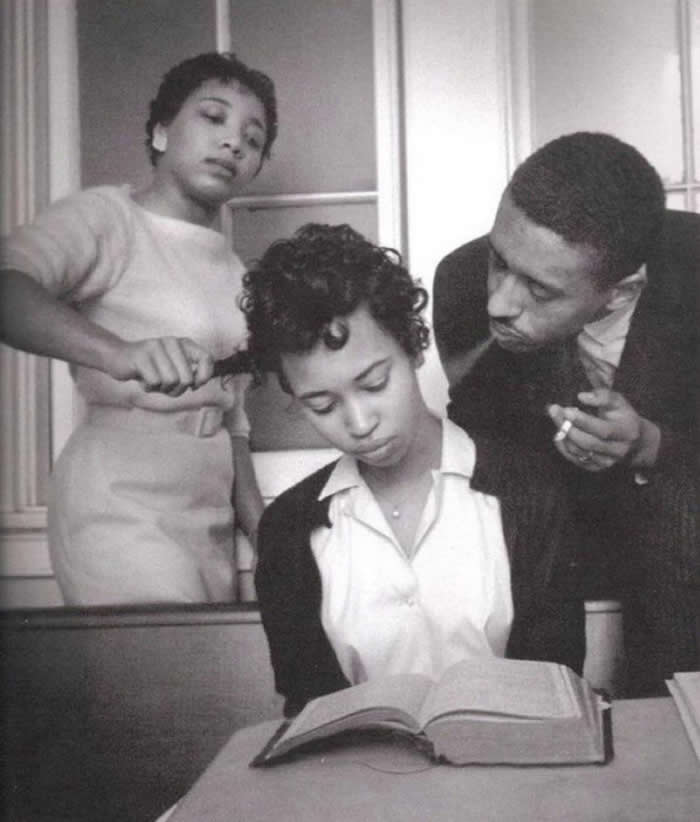 A young girl in a school for black civil rights activists being trained to not react to smoke blown in her face, 1960