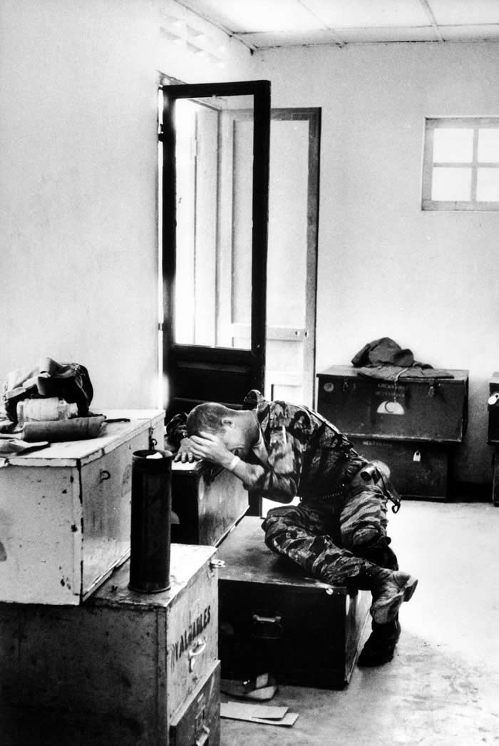 Chopper door gunner post-mission, Vietnam 1965. Photograph by Larry Burrows