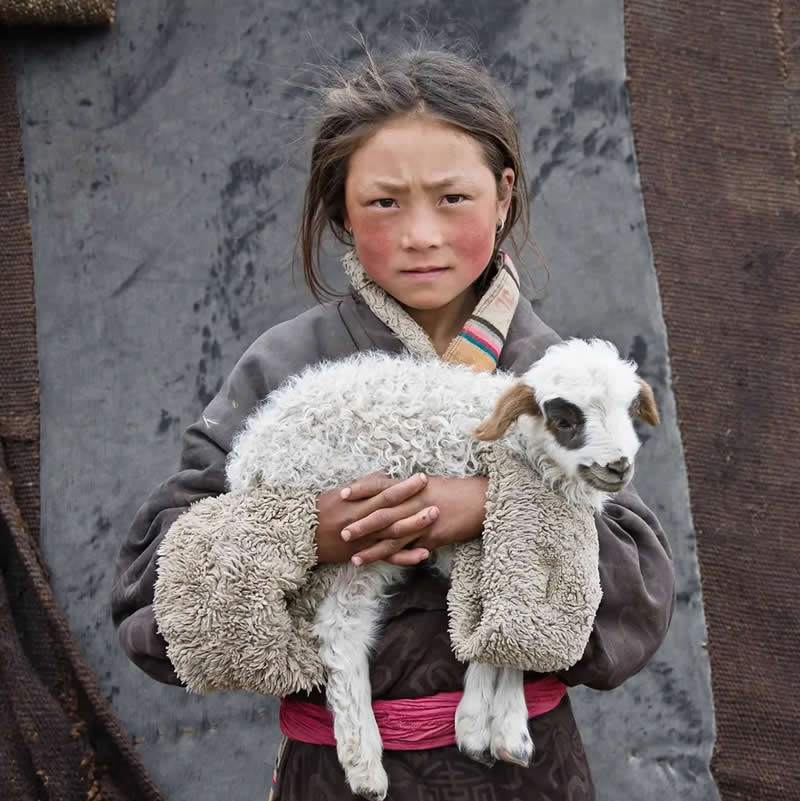 Young Nomad w/ Lamb, Tibet by Larry K. Sinder, United States - AAP Magazine 2026 Portrait Awards Winners