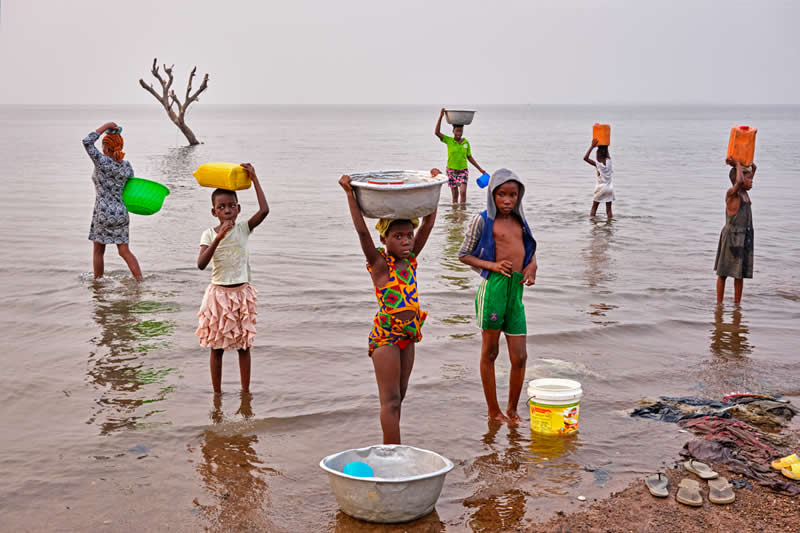 3rd Place winner: Fetching Water by Regula Tschumi, Switzerland - Chromatic Awards Street and Travel Winners