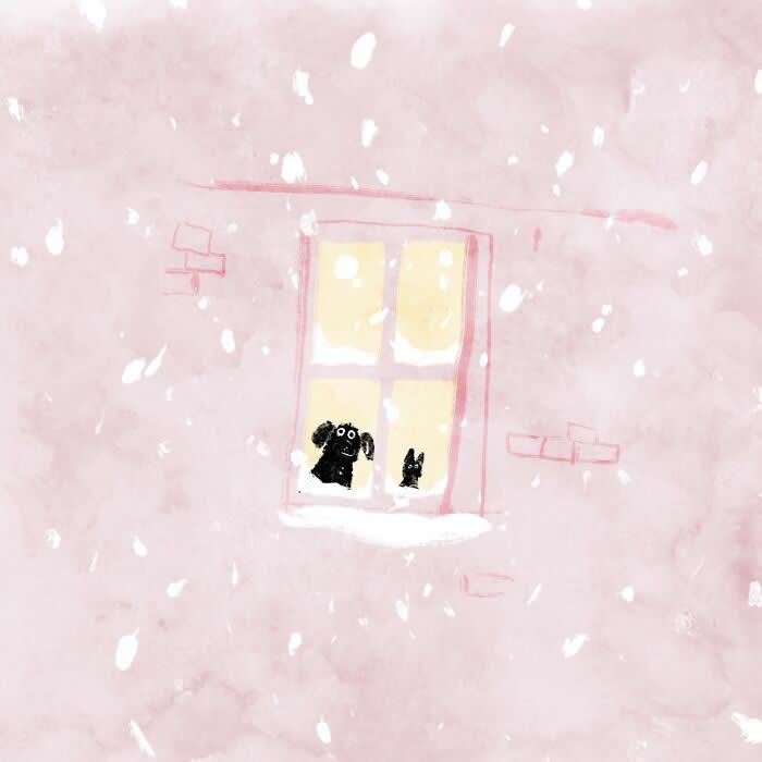 Illustration by John Bond showing a dog and cat looking out from a warmly lit window during snowfall. Soft pink tones, painterly textures, and falling snowflakes create a cozy winter scene filled with warmth, friendship, and quiet wonder.