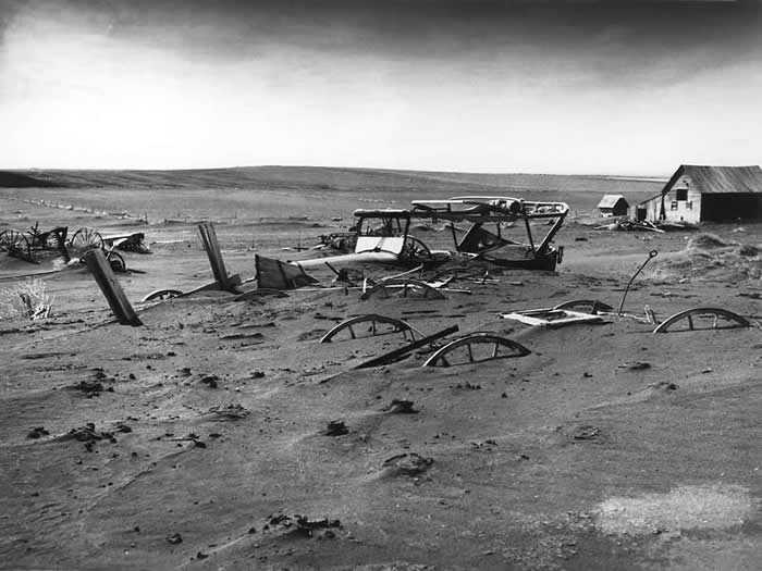 Machinery buried by dust in South Dakota, 1936. (The Dust Bowl disaster for the 1930s)