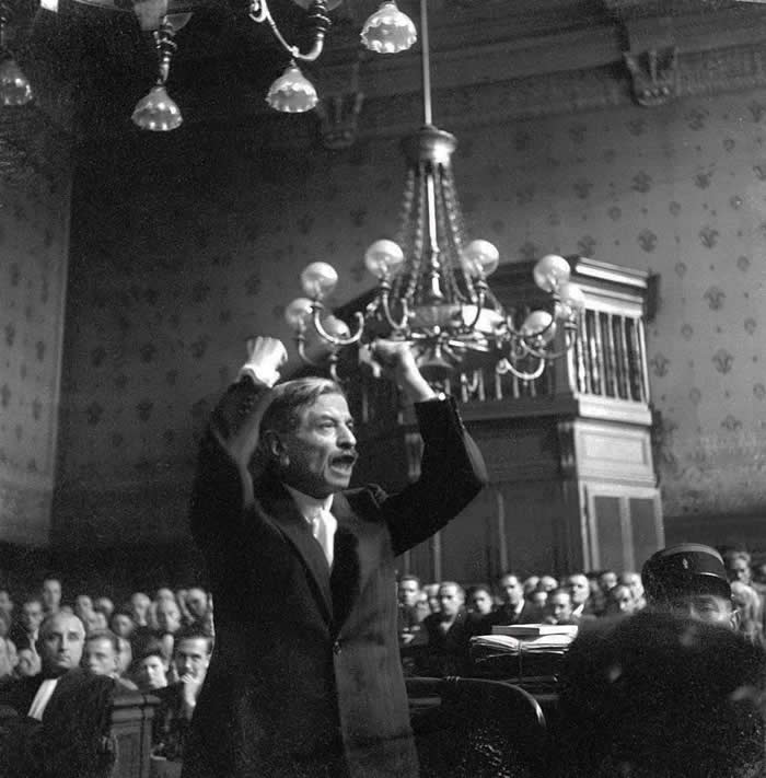 Pierre Laval, former Prime Minister of the Vichy French government, passionately pleads his case while on trial for treason at the Palais de Justice in Paris, France. August 1945. Laval was found guilty and exėcuted in October.