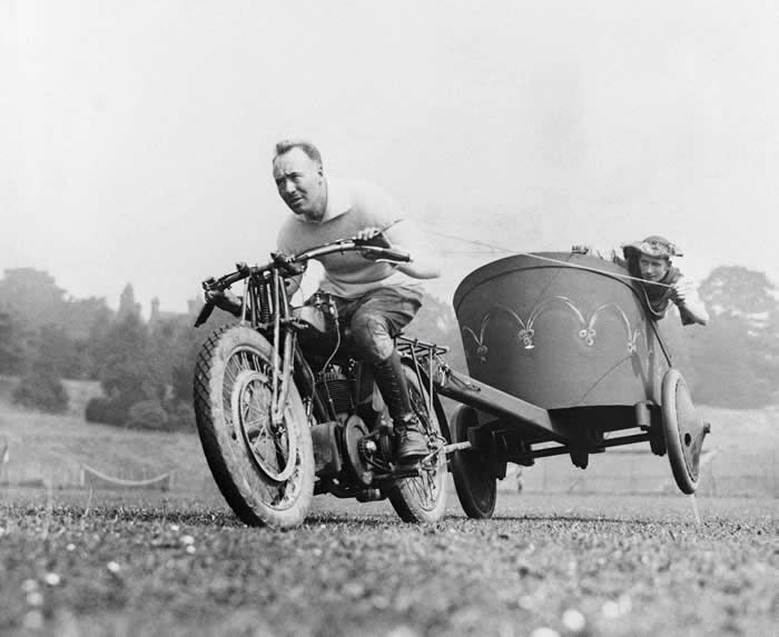 Two men participating in a motorcycle chariots race, 1925.