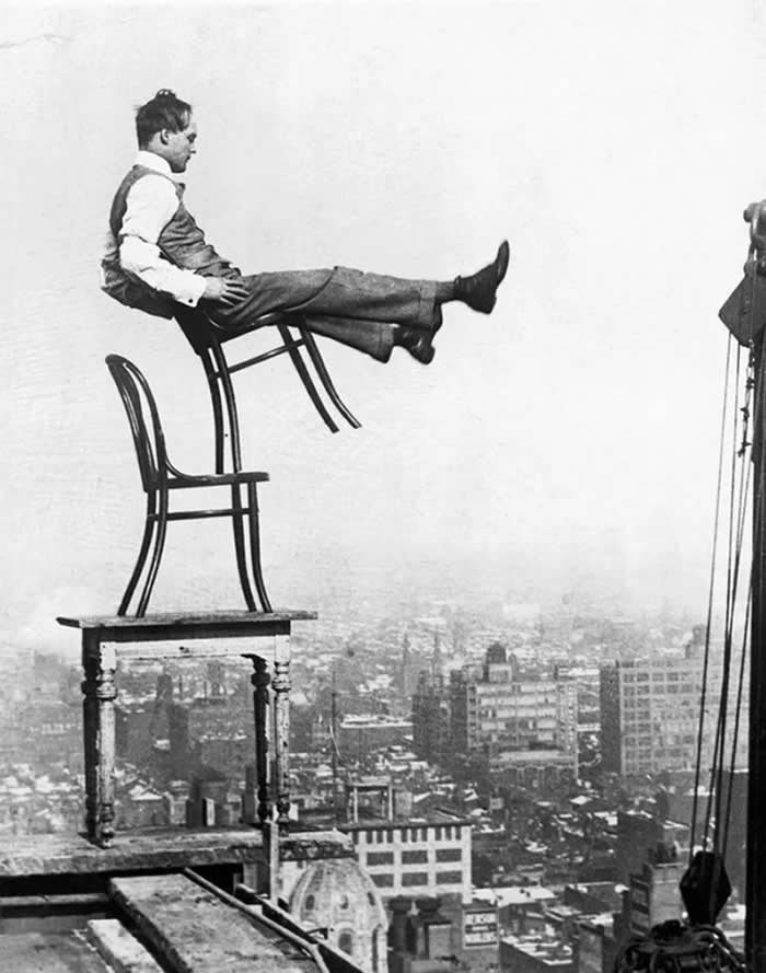 "Human Fly" John "Jammie" Reynolds balancing on a New York rooftop, 1910s.