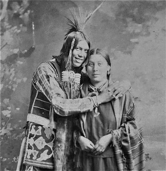 A Ponca couple posing together for their wedding photo. (c. 1900)