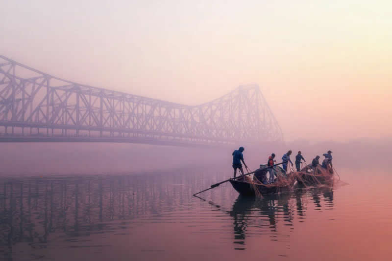 Bengali fishermen at work at sunrise. Winner of Bring Home the Harvest category. | Marco Rutten/World Food Photography Awards sponsored by Bimi