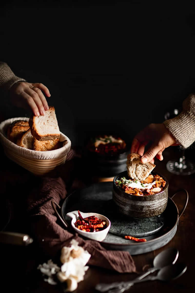 Dipping Bread into Stew. Winner of the M&S Food Rising Star category. | Sarah-Vanessa Schneider/World Food Photography Awards sponsored by Bimi