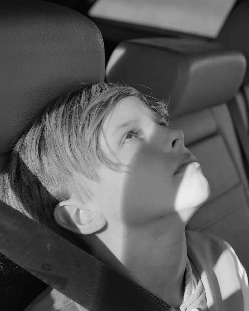 1st Place Winner: Francis in his father&rsquo;s Mercedes wagon by Anastasia Pagonas, United States - AAP Magazine Awards 2026 Black and White Winners