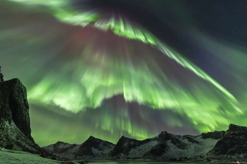 An Auroral Deluge by Julien Cadena - Lyngen, Troms, Norway - Astronomy Photographer of the Year 2026 shortlists