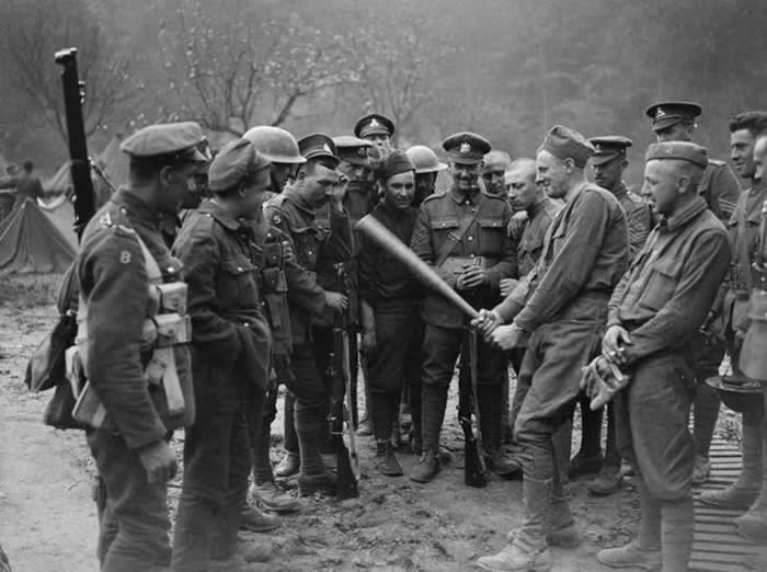 American soldiers explaining to British soldiers what the American game of baseball is like. (1940s)