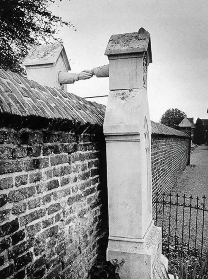 The graves of a Catholic woman and her Protestant husband, separated by a wall, Netherlands, 1888