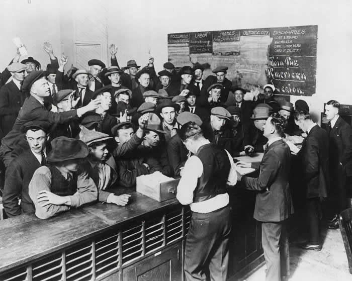 Crowd of men at Employment Office Desk, during the Great Depression.