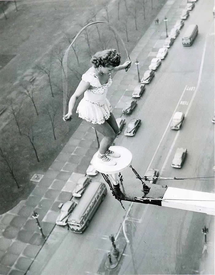 Daredevil aerialist Betty Fox performs from the roof of the Fort Shelby Hotel, Michigan, 1945.