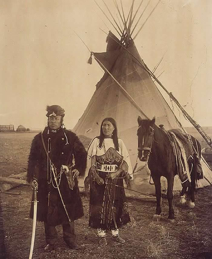 Dog Child, a North West Mounted Police scout, and his wife, The Only Handsome Woman, members of the Blackfoot Nation, Gleichen, Alberta, ca. 1890