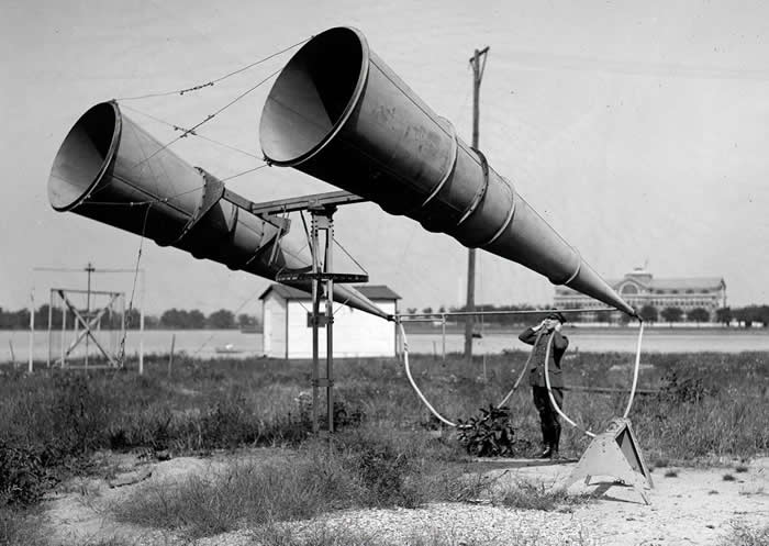 Using a two-horn listening device at Bolling Field in Washington, D.C., in 1921 before the invention of radar, to listen for distant aircraft.