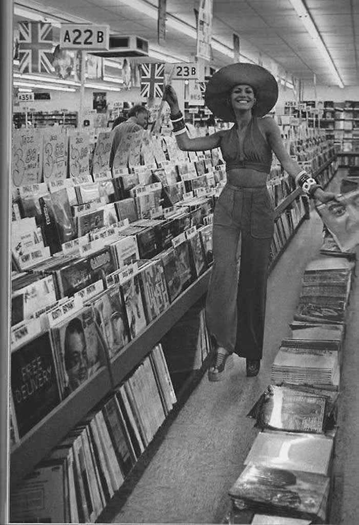A lady a record store in the 1970s