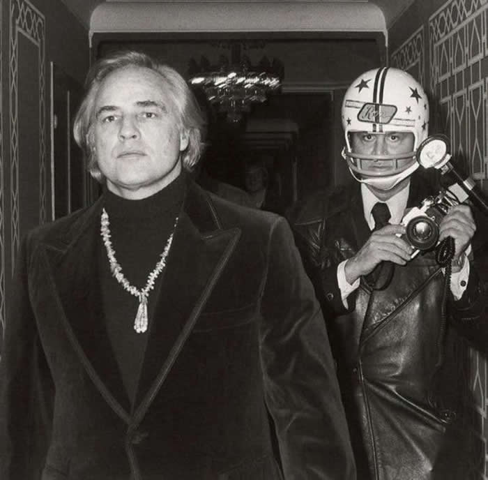 Paparazzi photographer Ron Galella would wear a football helmet around actor Marlon Brando, after Brando once sucker-punched him, broke his jaw, and knocked out five teeth in 1973.