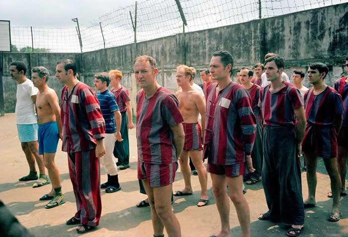 American prisoners of war stand for roll call in the courtyard of Nga Tu So prison, Hanoi, North Vietnam. March 1973.