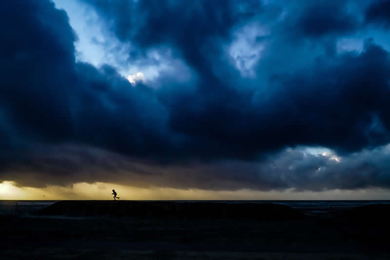 Escape from the storm by Stephane Navailles, France - Academy Photo Awards 2026 Landscape Winners
