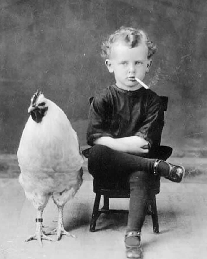 A boy and his chicken. 1910. - Animals Stole the Spotlight Historic Photos