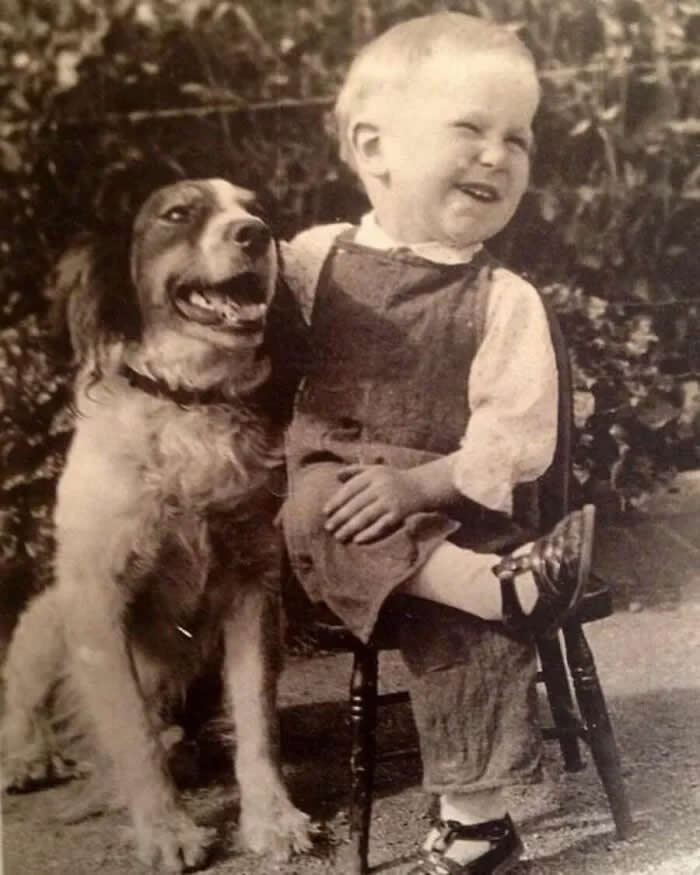 A boy and his dog share a laugh, 1930s. - Animals Stole the Spotlight Historic Photos