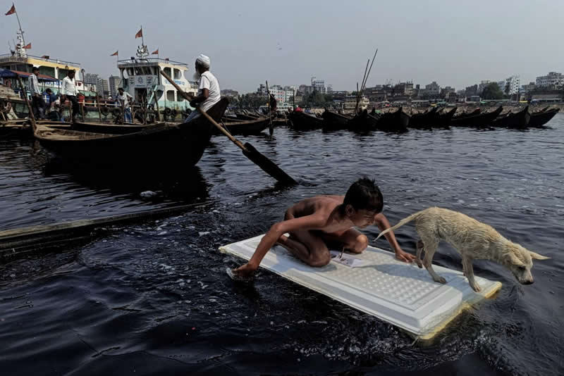 Urban Photo Awards 2026: 35 Finalist Photos That Turn Everyday Streets Into Art 43 Song Of The Buriganga by Bijoy Paul - Urban Photo Awards 2026 Street Finalists
